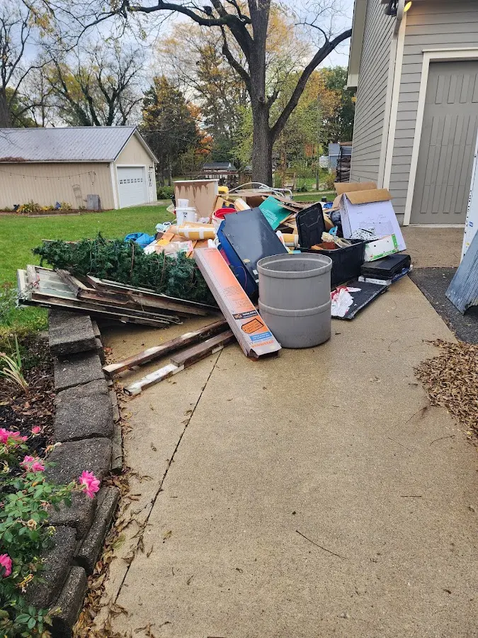 Dumpster being loaded with debris for 30 Yard Dumpster Rental in Central City